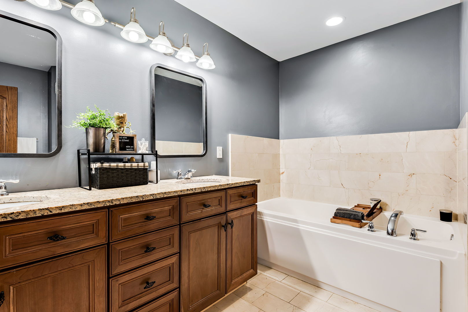 2002 Sandstone Trail Kankakee, IL 60901 - Photo 17 of 27 a bathroom with a tub sink and mirror