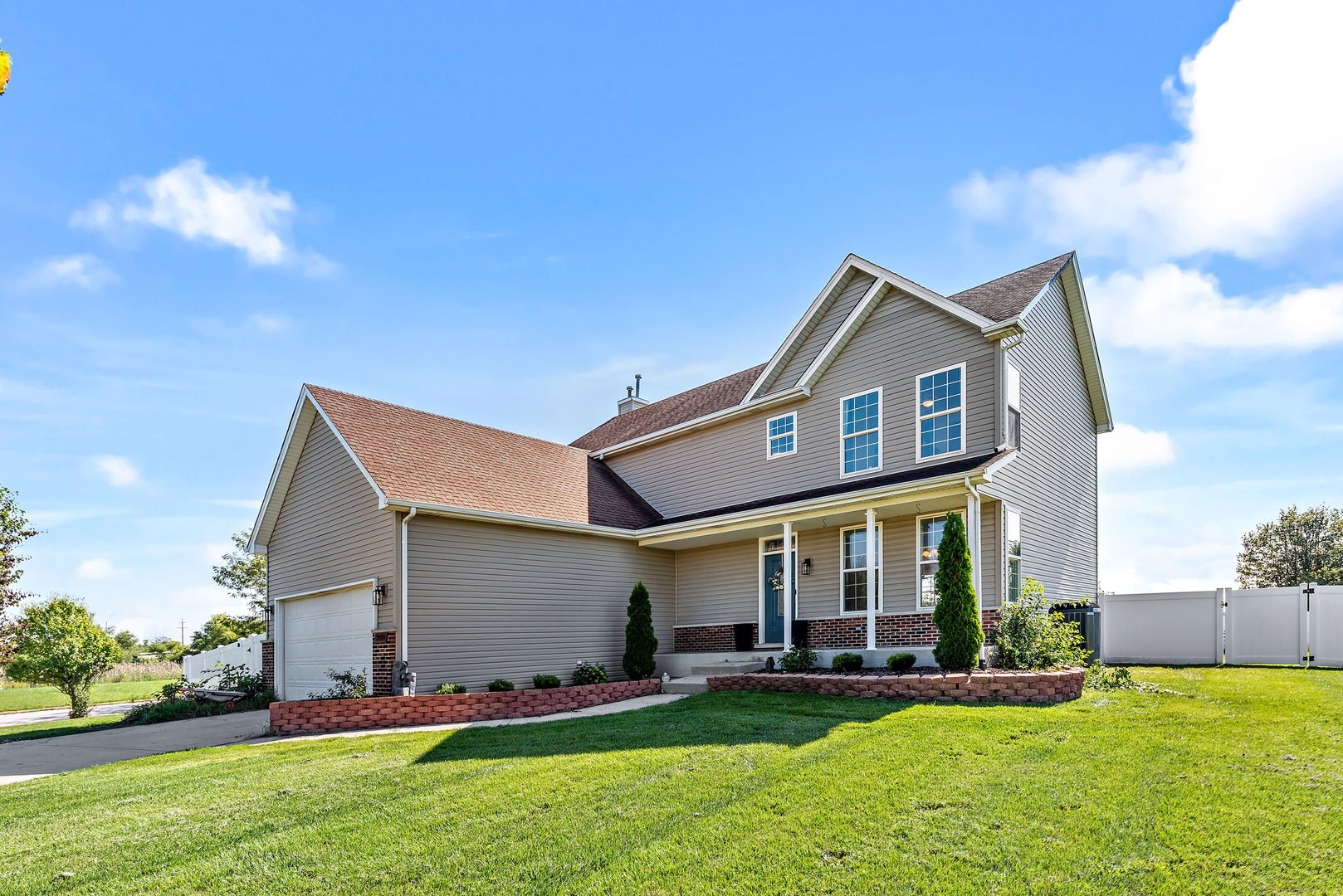2002 Sandstone Trail Kankakee, IL 60901 - Photo 2 of 27 a front view of a house with a yard