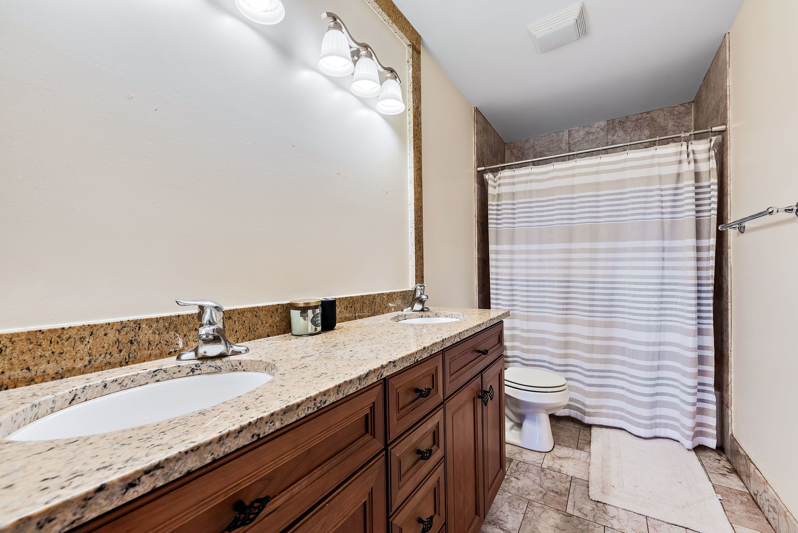 2002 Sandstone Trail Kankakee, IL 60901 - Photo 21 of 27 a bathroom with a granite countertop sink and a mirror