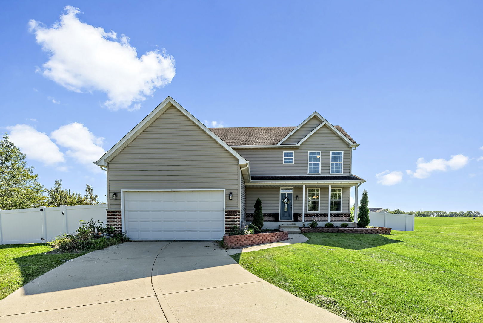 2002 Sandstone Trail Kankakee, IL 60901 - Photo 27 of 27 a front view of a house with yard and garage