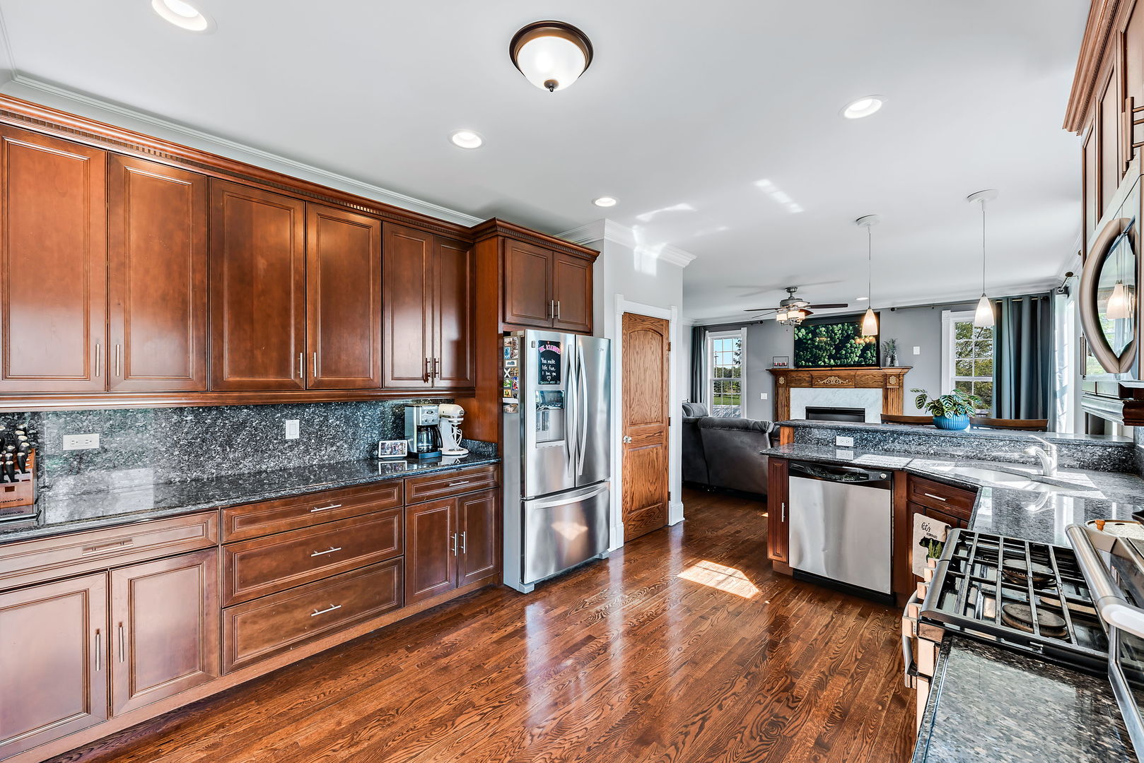 2002 Sandstone Trail Kankakee, IL 60901 - Photo 10 of 27 a kitchen with stainless steel appliances granite countertop a refrigerator and stove