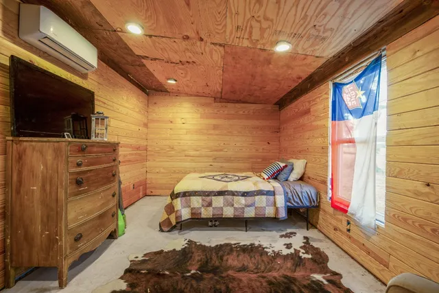 a room with furniture and a flat screen tv