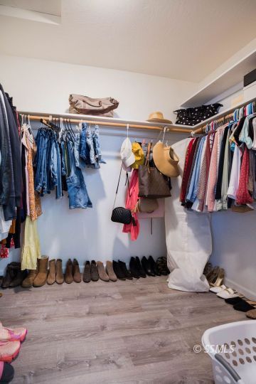 199 East Upjohn Avenue Ridgecrest, CA 93555 - Photo 19 of 30 a view of walk in closet with clothes and shoes