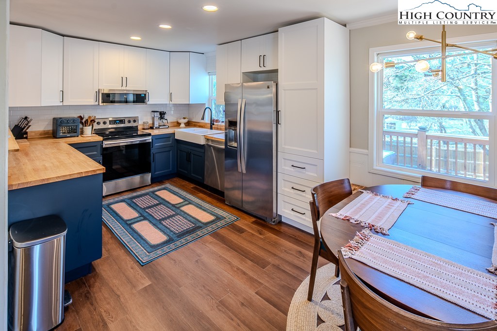 477 Hardaman Circle Boone, NC 28607 - Photo 13 of 48 a kitchen with stainless steel appliances granite countertop a refrigerator stove top oven a sink and dishwasher