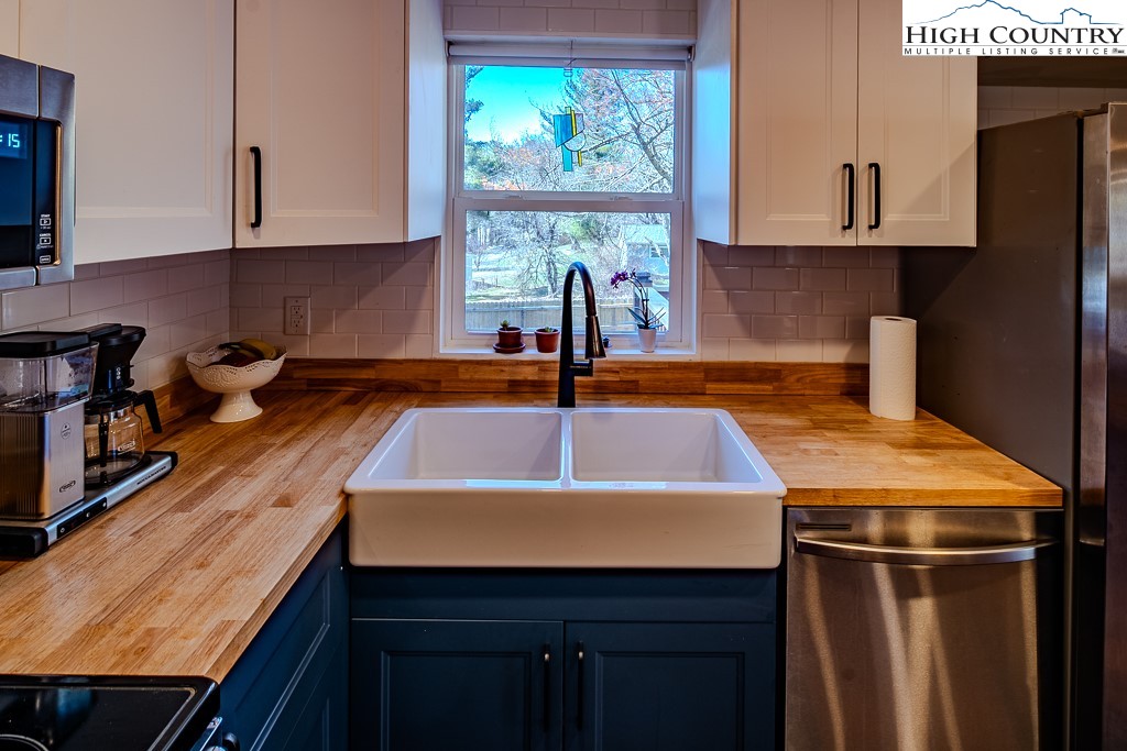 477 Hardaman Circle Boone, NC 28607 - Photo 15 of 48 a kitchen with kitchen island a sink and a window