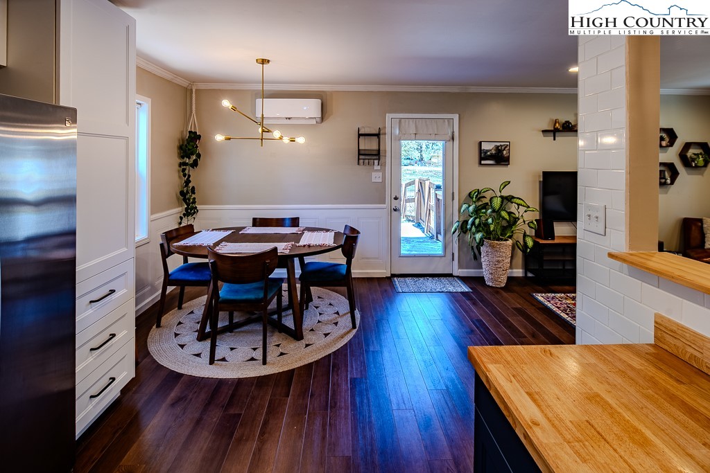 477 Hardaman Circle Boone, NC 28607 - Photo 18 of 48 a view of a dining room with furniture and wooden floor