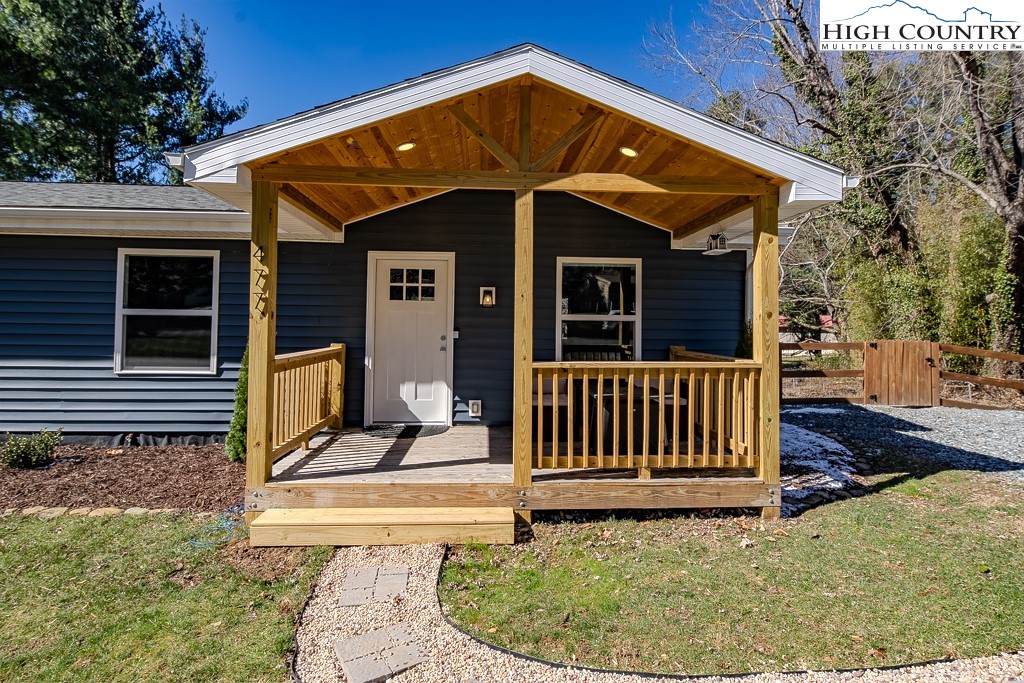 477 Hardaman Circle Boone, NC 28607 - Photo 2 of 48 a view of a house with backyard and porch