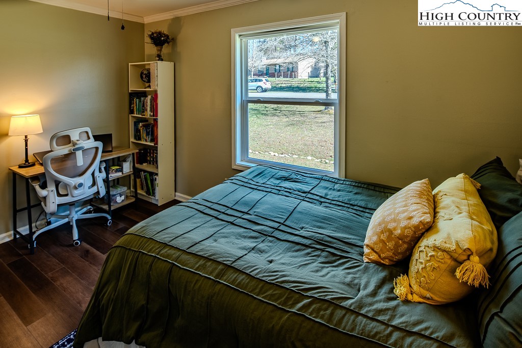 477 Hardaman Circle Boone, NC 28607 - Photo 26 of 48 a bedroom with a bed and a table in it