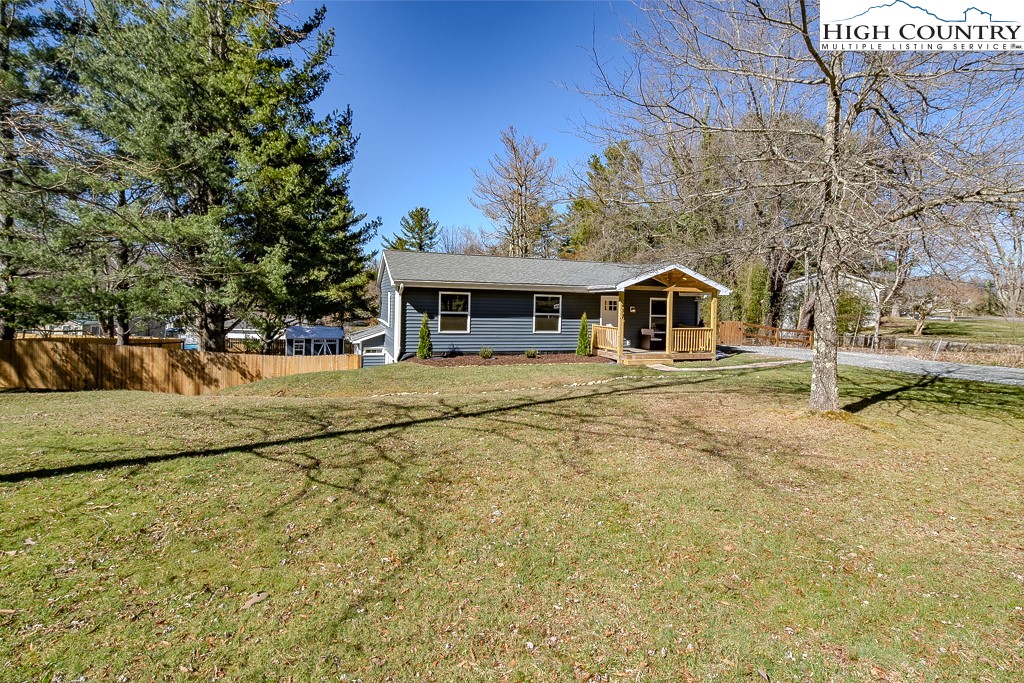 477 Hardaman Circle Boone, NC 28607 - Photo 3 of 48 a front view of a house with a yard