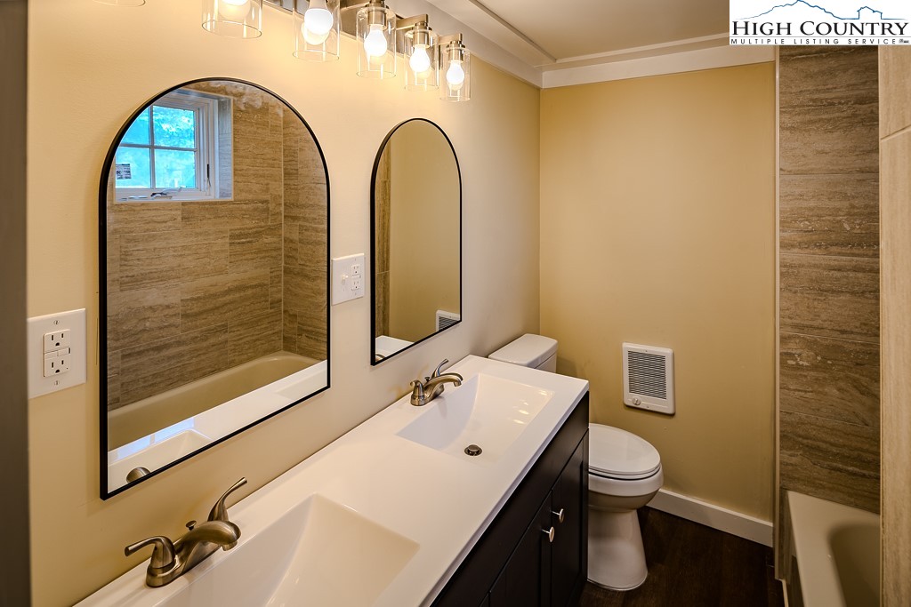 477 Hardaman Circle Boone, NC 28607 - Photo 34 of 48 a bathroom with a sink and a mirror