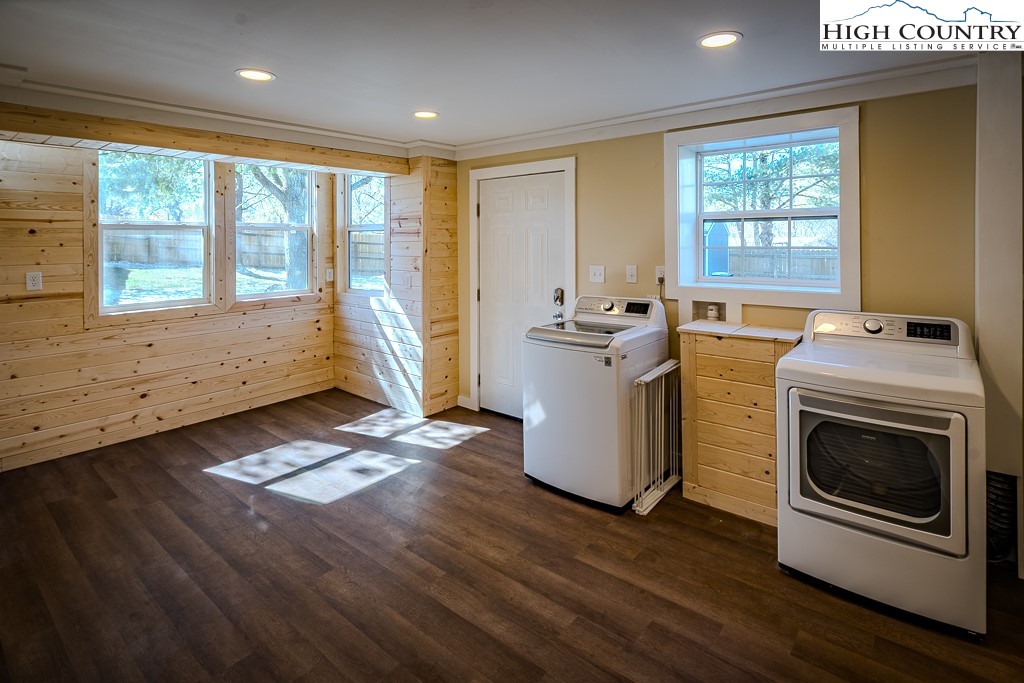 477 Hardaman Circle Boone, NC 28607 - Photo 39 of 48 a kitchen with sink wooden floor and stainless steel appliances
