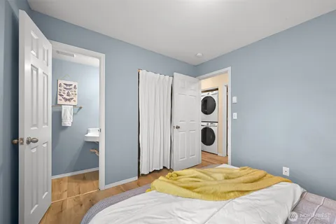 a bedroom with a bed and wall painting