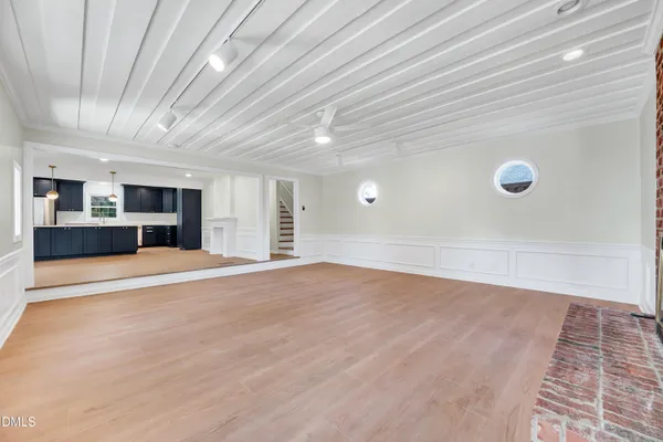 a view of empty room with a fireplace