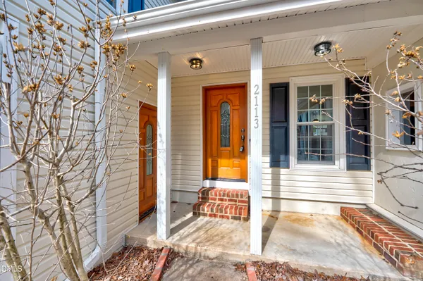 a view of a brick house with a large window