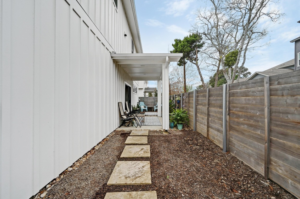 7601 Cooper Lane, Unit 6 Austin, TX 78745 - Photo 26 of 29 a view of a pathway of a house with wooden floor