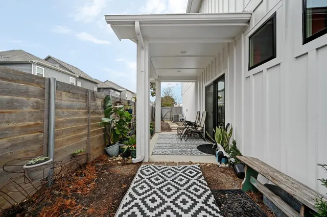a couple of potted plants in front of door