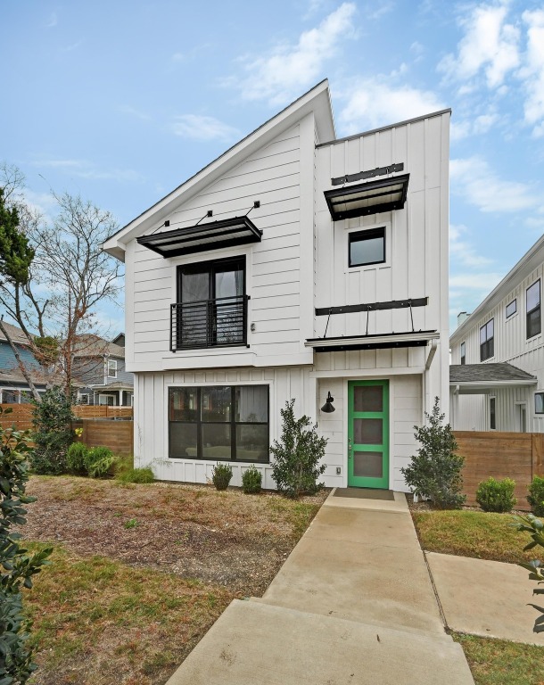 7601 Cooper Lane, Unit 6 Austin, TX 78745 - Photo 4 of 29 View of front of home featuring board and batten siding and a balcony