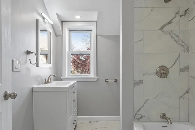 a bathroom with a sink and a mirror
