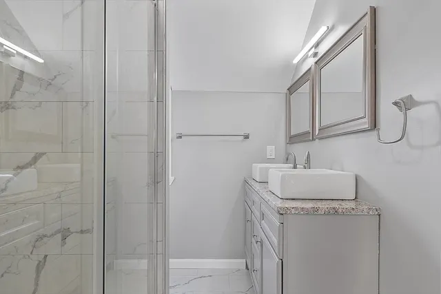 a bathroom with a sink and a mirror