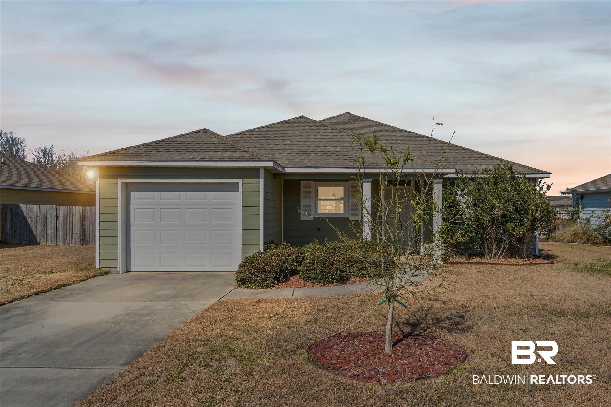 919 Sailor Circle Foley, AL 36535 - Photo 1 of 24 Single story home featuring roof with shingles, concrete driveway, and a garage