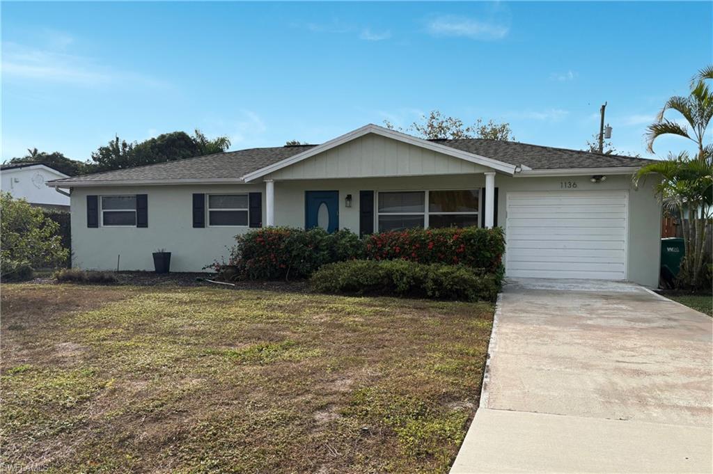 a grey house with yard