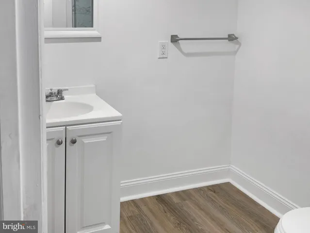 a bathroom with a sink and vanity
