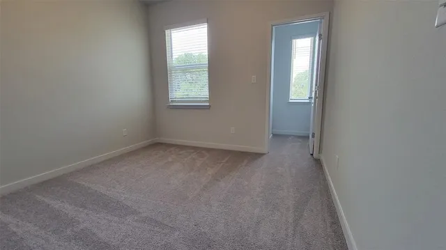 a bathroom with a granite countertop bathtub shower sink and toilet