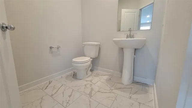 a kitchen with stainless steel appliances granite countertop a stove microwave and refrigerator