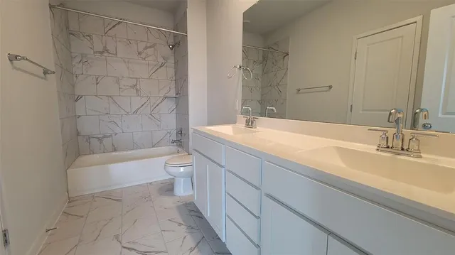 a kitchen with kitchen island granite countertop a sink window and wooden floor