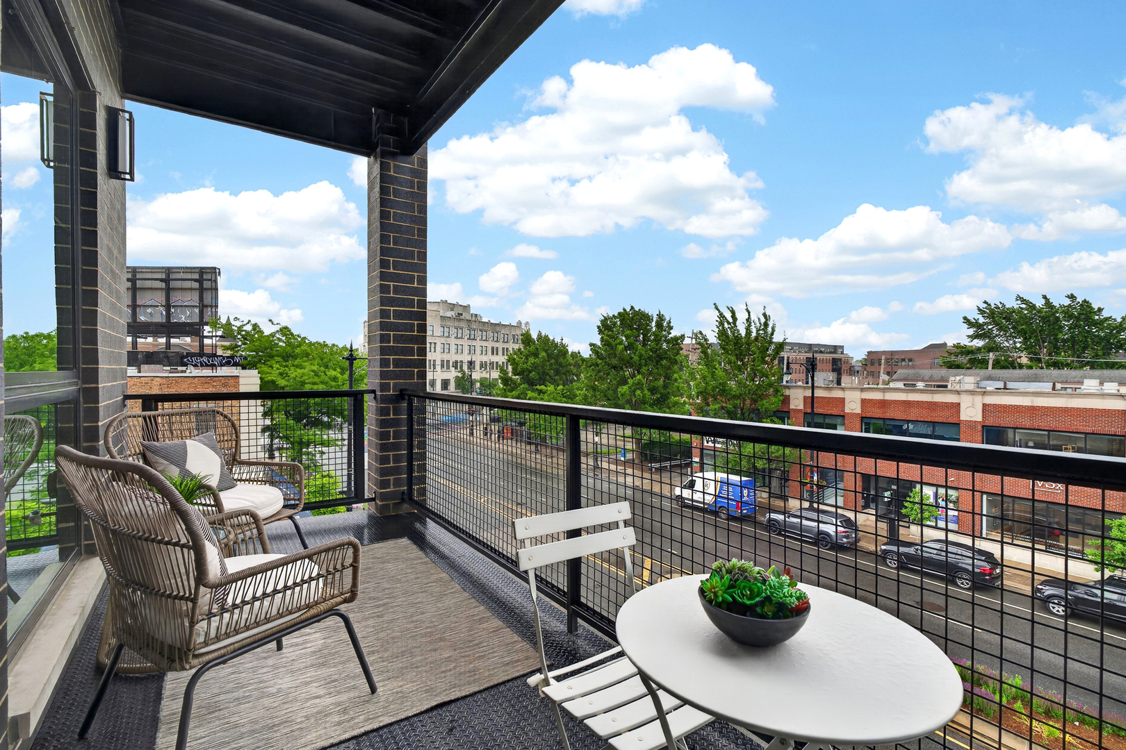 2024 West Irving Park Road, Unit 302 Chicago, IL 60618 - Photo 27 of 32 a view of a deck with a table and chairs