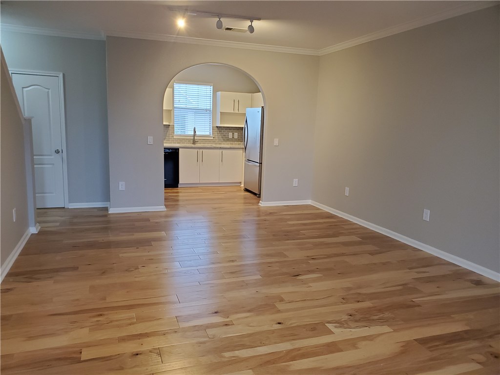 11203 Ranch Road 2222, Unit 302 Austin, TX 78732 - Photo 2 of 18 Kitchen opens to spacious living area