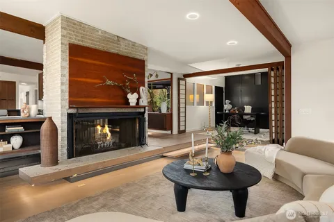 a living room with furniture a lamp and a fireplace