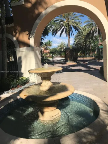 a view of a swimming pool with a yard