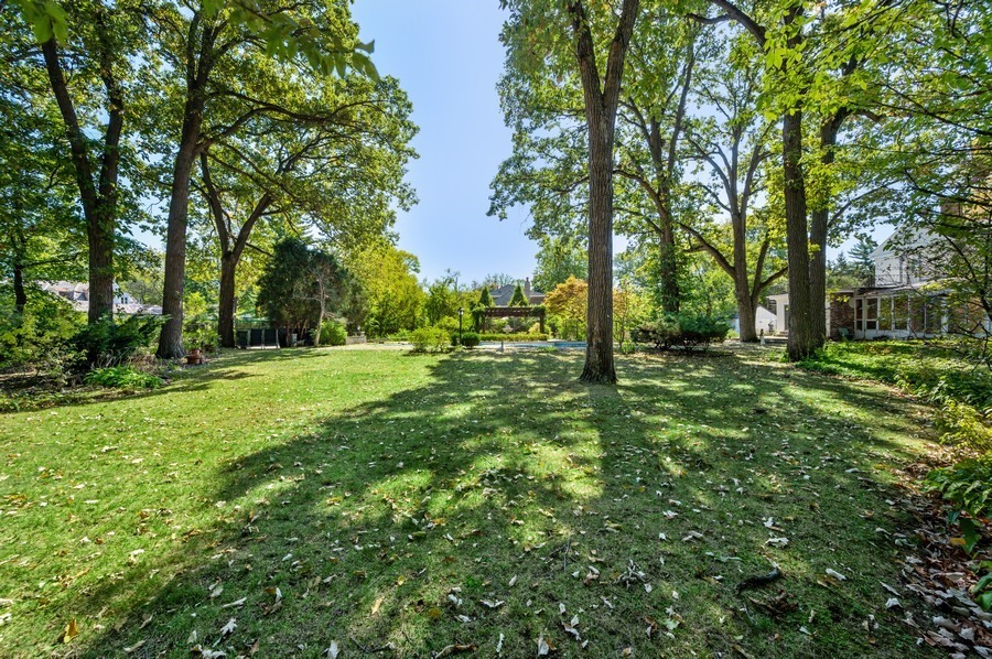 39 Locust Road Winnetka, IL 60093 - Photo 4 of 16 a view of outdoor space with deck and trees