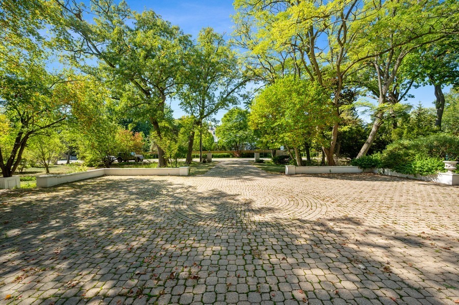 39 Locust Road Winnetka, IL 60093 - Photo 10 of 16 a view of swimming pool and trees
