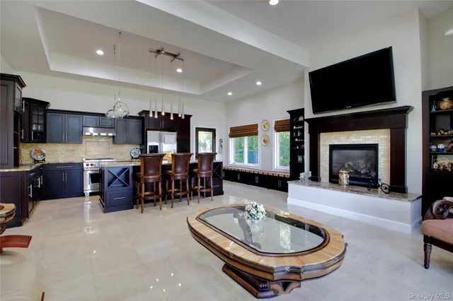 a bedroom with a large bed and a painting on the wall