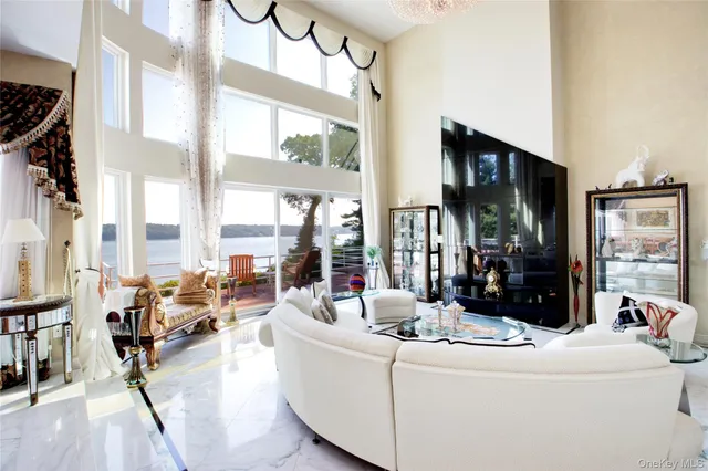 a living room with furniture and kitchen view