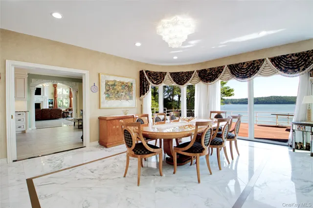 a dinning area with pool table and chairs