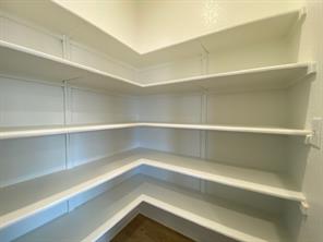 213 Saide Street Georgetown, TX 78626 - Photo 13 of 32 Walk-in pantry featuring extensive white shelving
