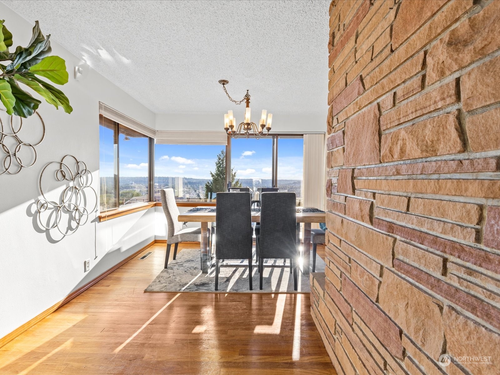 801 Grant Avenue South Renton, WA 98057 - Photo 12 of 40 a view of a dining room with furniture and wooden floor