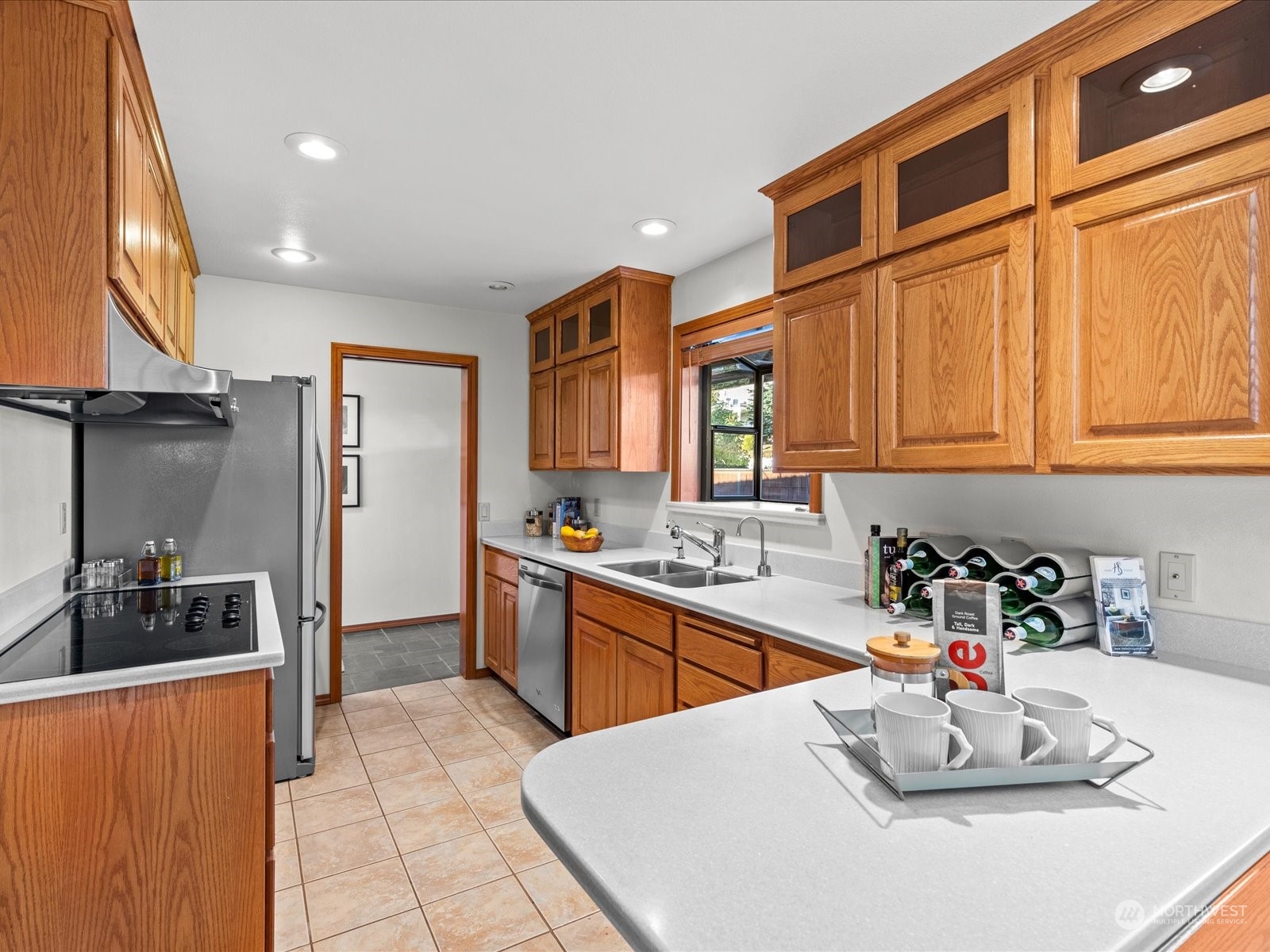 801 Grant Avenue South Renton, WA 98057 - Photo 14 of 40 a kitchen with stainless steel appliances kitchen island granite countertop a sink and cabinets