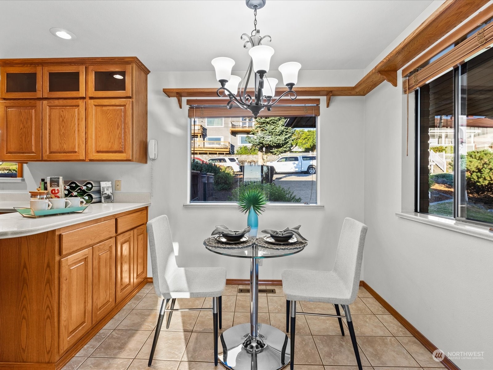 801 Grant Avenue South Renton, WA 98057 - Photo 15 of 40 a dining room with furniture a chandelier and wooden floor