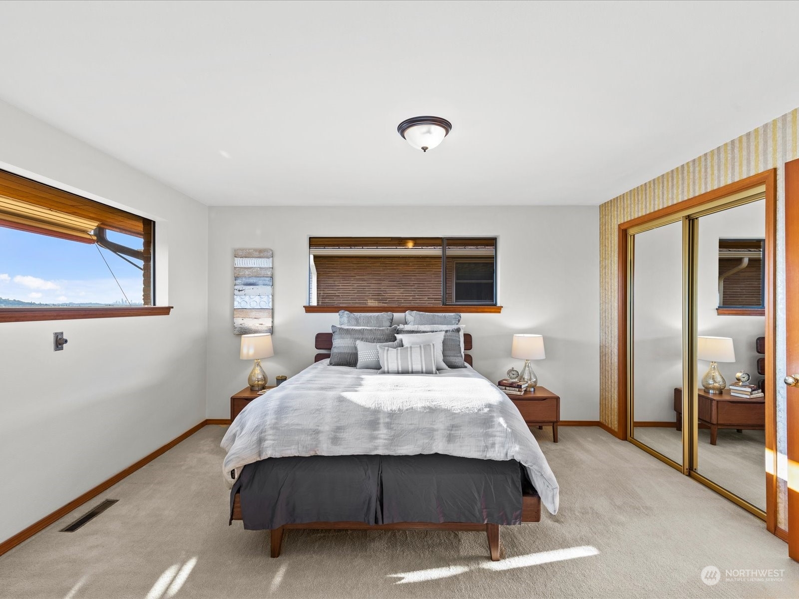 801 Grant Avenue South Renton, WA 98057 - Photo 19 of 40 a bedroom with a bed and glass windows