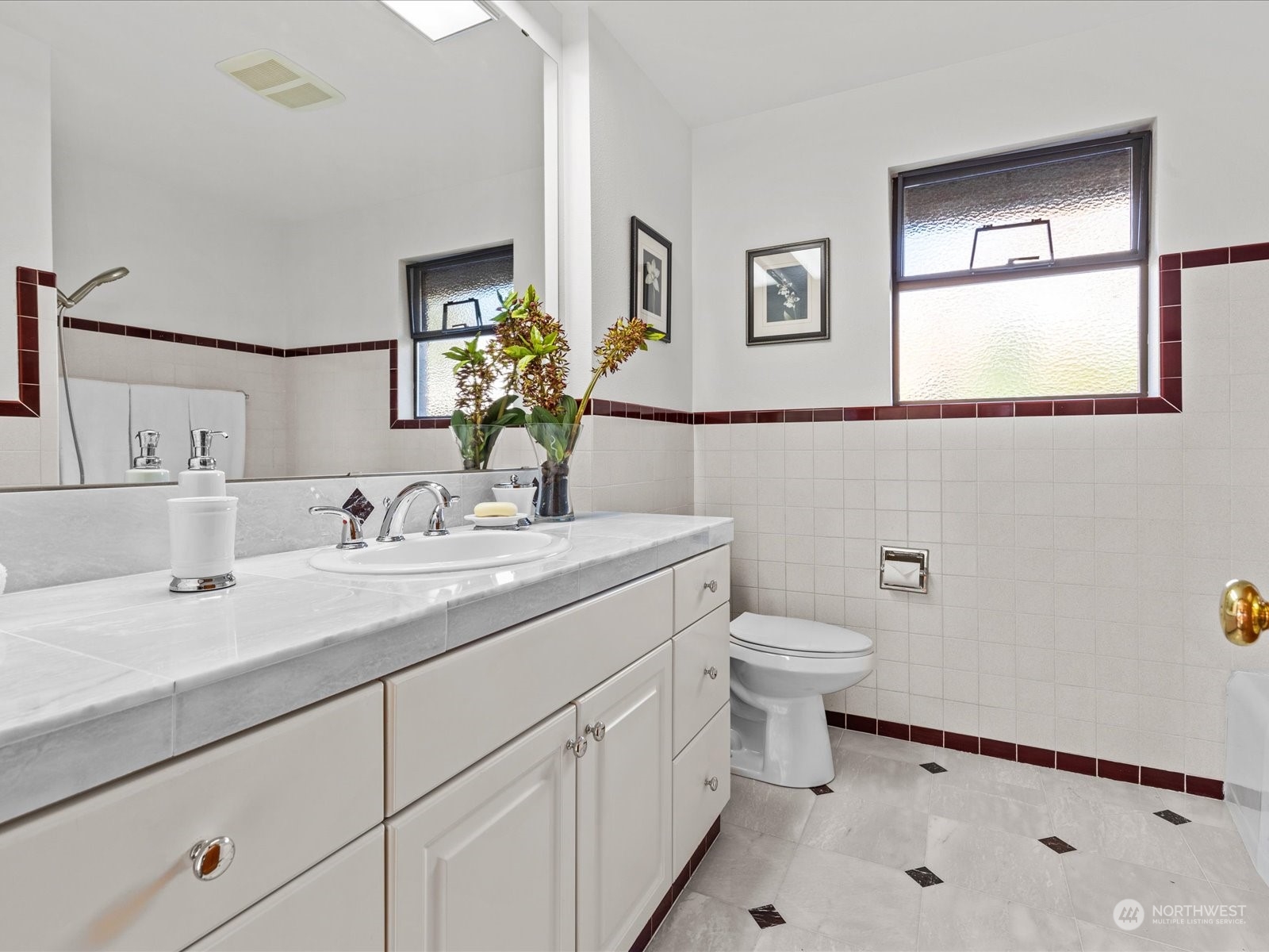 801 Grant Avenue South Renton, WA 98057 - Photo 20 of 40 a bathroom with a toilet a sink a mirror and a faucet