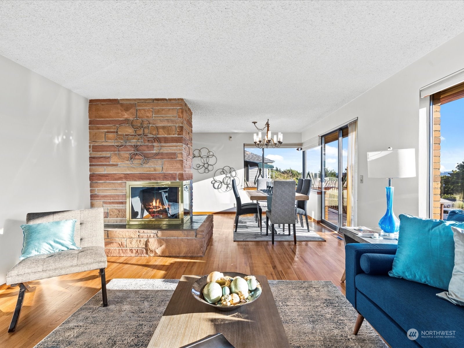 801 Grant Avenue South Renton, WA 98057 - Photo 6 of 40 a living room with fireplace furniture and a floor to ceiling window