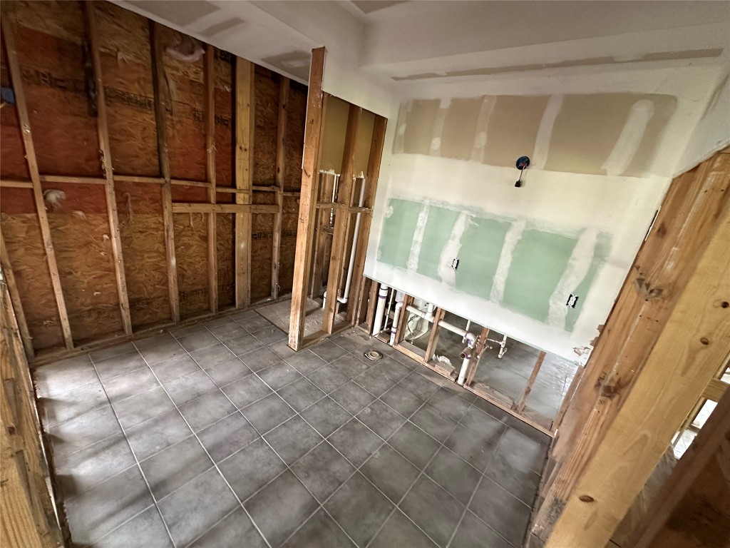 7700 Farm To Market 1010 Road Cleveland, TX 77327 - Photo 5 of 9 a view of an empty room with stairs