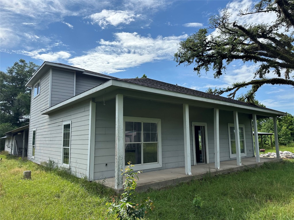 7700 Farm To Market 1010 Road Cleveland, TX 77327 - Photo 7 of 9 front view of a house with a yard