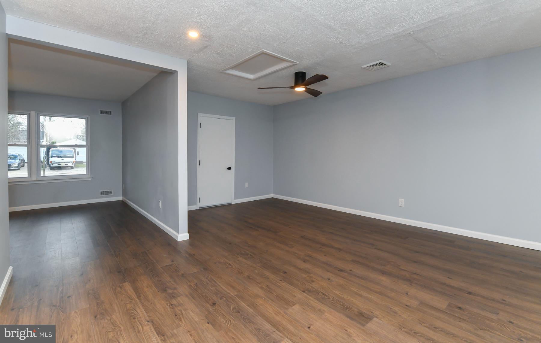 10 Ivy Lane Sicklerville, NJ 08081 - Photo 16 of 30 an empty room with wooden floor and windows