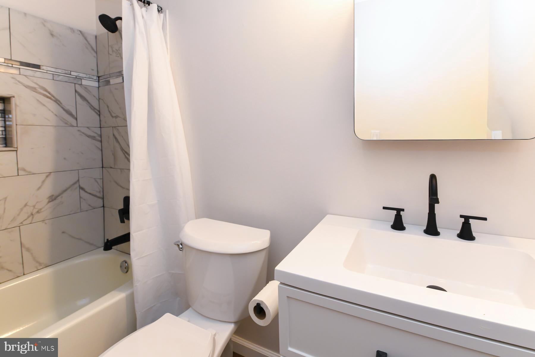 10 Ivy Lane Sicklerville, NJ 08081 - Photo 23 of 30 a bathroom with a sink a toilet and bathtub