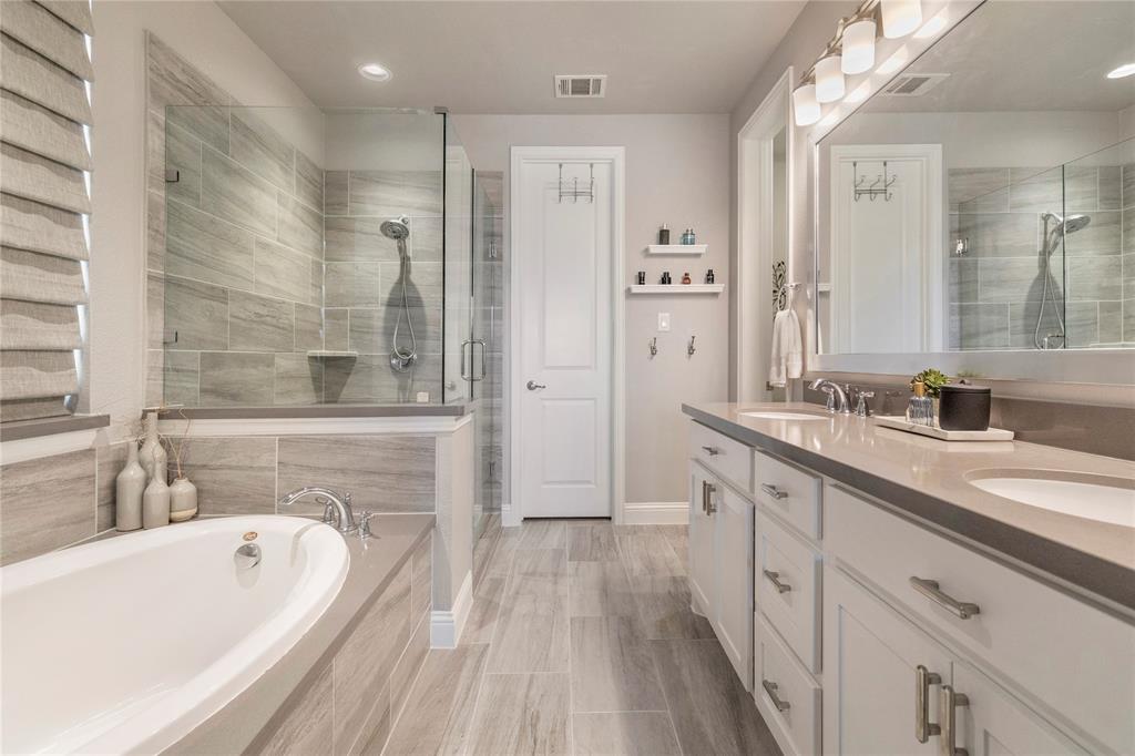 6201 Cupleaf Road Flower Mound, TX 76226 - Photo 11 of 40 a spacious bathroom with a double vanity sink a mirror and a bathtub